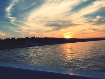 Scenic view of calm sea at sunset