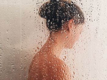 Topless woman bathing bathroom