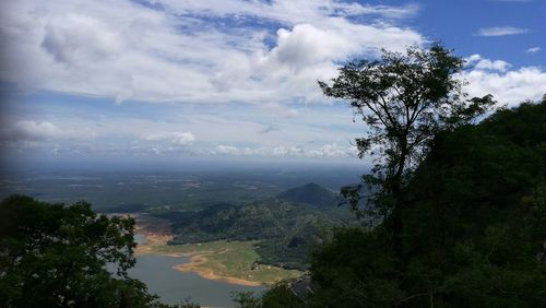 Scenic view of tree mountains against sky