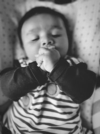 Cute baby girl on bed at home