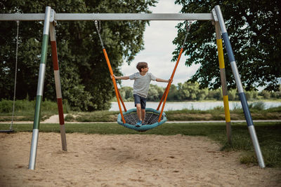 Boy on swing at playground