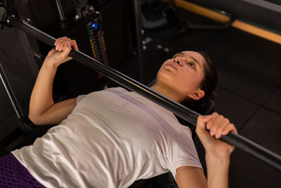 Midsection of woman exercising in gym