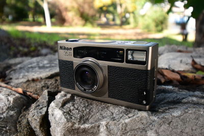 Close-up of camera on rock