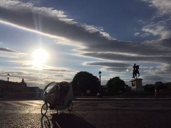 Motorcycle against sky during sunset