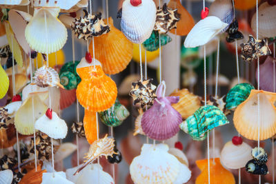 Close-up of decorations hanging for sale at market stall