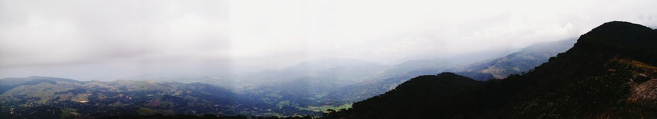 Panoramic view of mountains against sky during winter