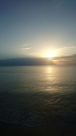 Scenic view of sea against sky at sunset