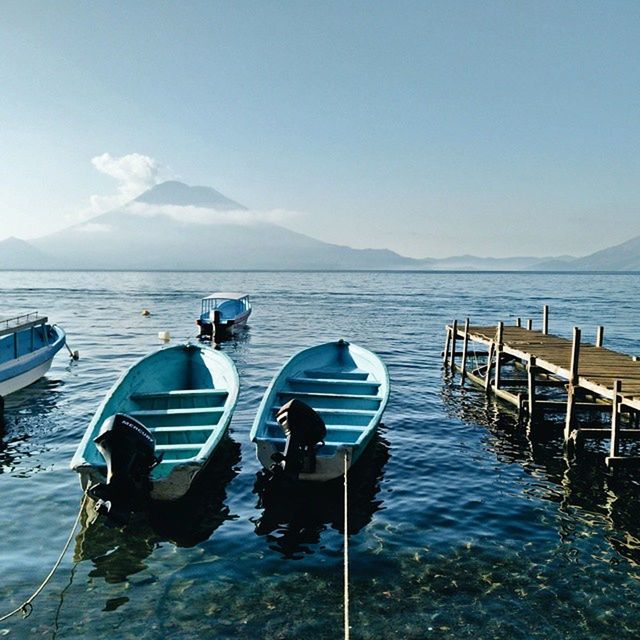 water, sea, nautical vessel, transportation, boat, mode of transport, horizon over water, blue, sky, scenics, tranquility, tranquil scene, nature, moored, beauty in nature, travel, clear sky, day, rippled, idyllic