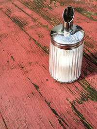 High angle view of container on old table