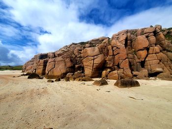 Rock formations on land against sky