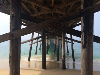 Pier on sea against sky