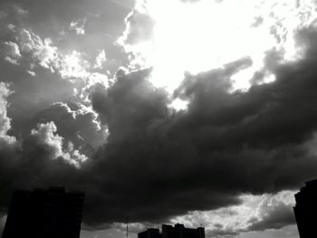 Low angle view of building against cloudy sky
