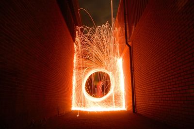 Illuminated light painting in alley at night