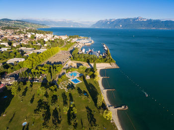 High angle view of sea and buildings against sky