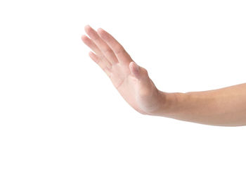 Close-up of hand over white background