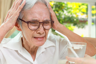 Senior woman having headache