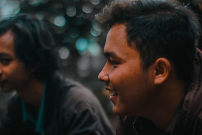 Close-up portrait of young man looking away