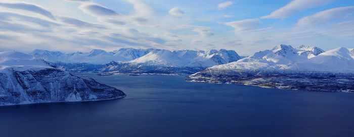 Scenic view of frozen lake against sky