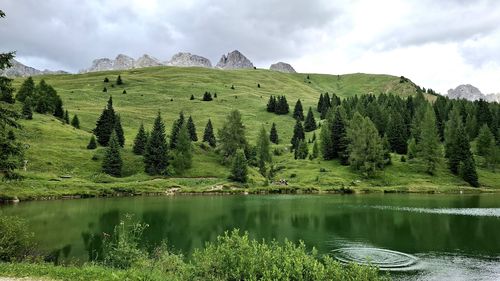 Scenic view of lake and mountains against sky