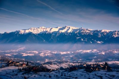 Scenic view of snowcapped mountains against sky