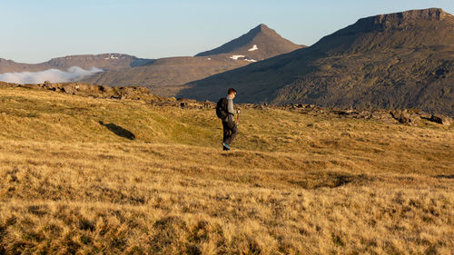 Full length of man on field against sky