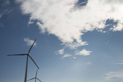 Low angle view of windmill against sky