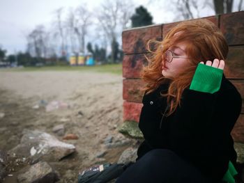 Woman sitting outdoors