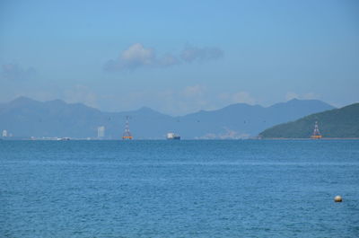 Scenic view of sea against blue sky