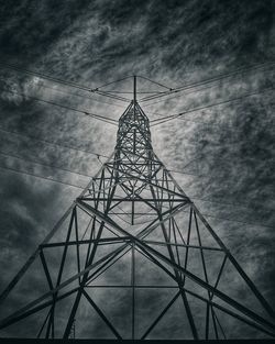 Low angle view of electricity pylon against sky