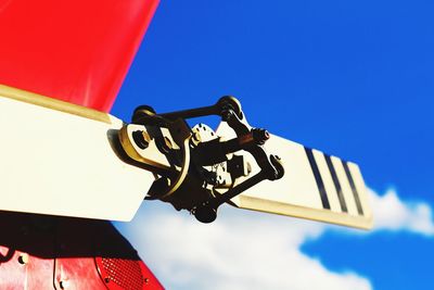 Low angle view of person against clear blue sky