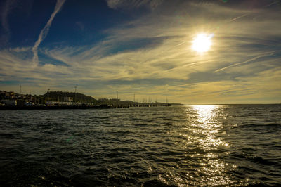 View of seascape against cloudy sky