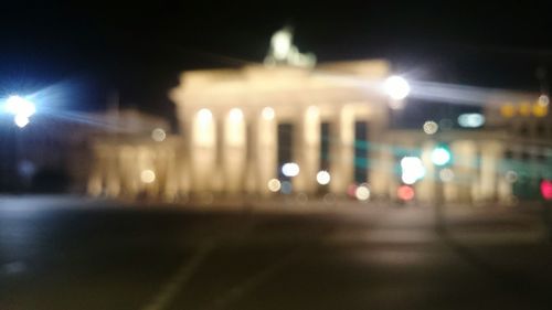 Defocused image of illuminated street lights at night