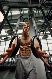 Muscular man working out in gym