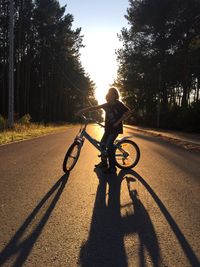 People riding bicycle on road