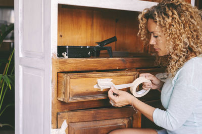 Portrait of young woman working in workshop