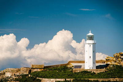 Lighthouse against cloudy sky