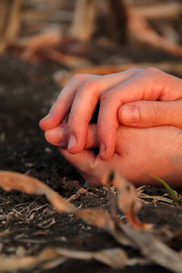 Close-up of person holding hands