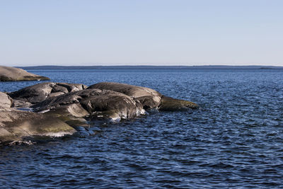 Scenic view of sea against clear sky