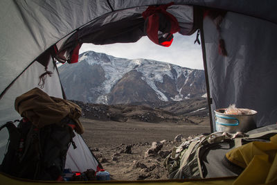 People on snowcapped mountains during winter