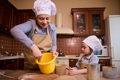 Portrait of man preparing food at home