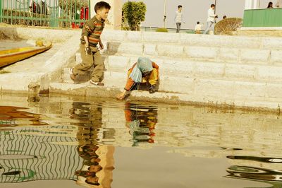 Reflection of woman in water