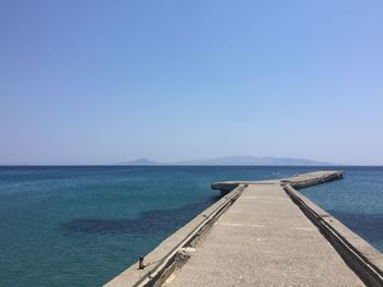 Scenic view of sea against clear blue sky