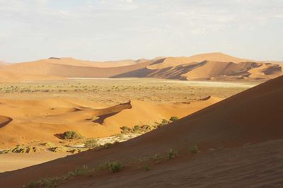 View of desert landscape against sky