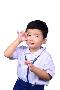 Boy holding camera over white background