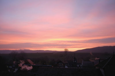 Scenic view of mountains against sky at sunset