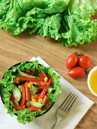 High angle view of chopped vegetables in plate on table