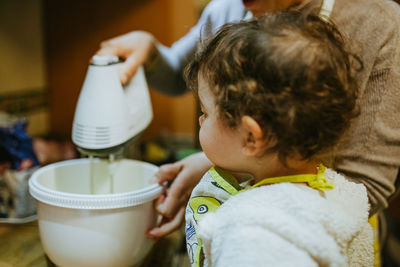 Close-up of girl by mother