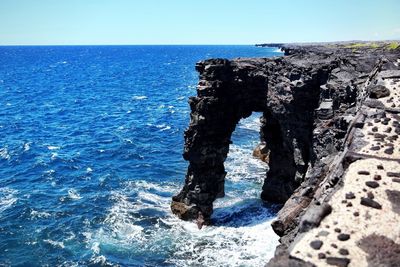 Scenic view of sea against blue sky