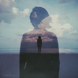 People standing by sea