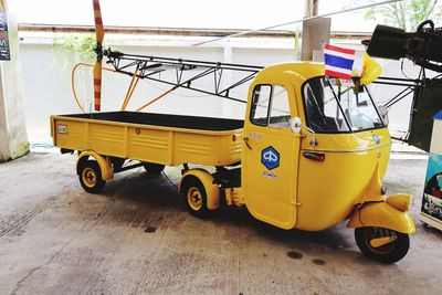 Yellow vintage car on street